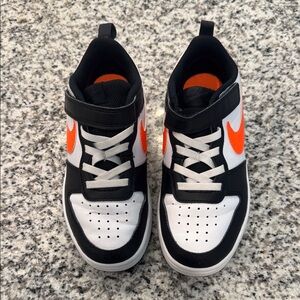 Nike Kids Black and White Sneakers with Orange Accents